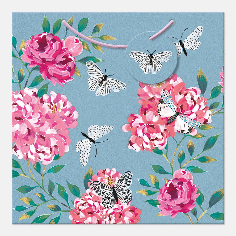 Floral design with pink flowers and black and white butterflies on a blue background