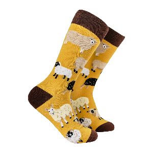 Yellow socks with sheep pattern on a white background